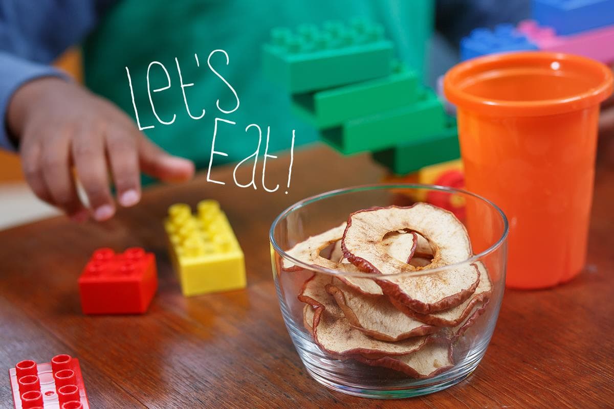 apple rings in a bowl legos on table let's eat