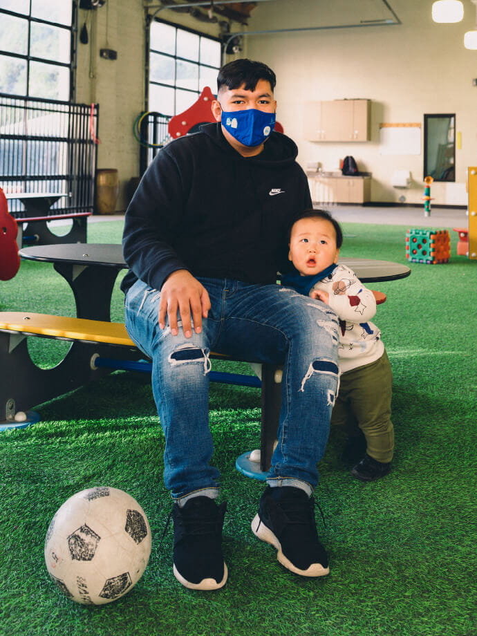 parent and boy with soccer ball
