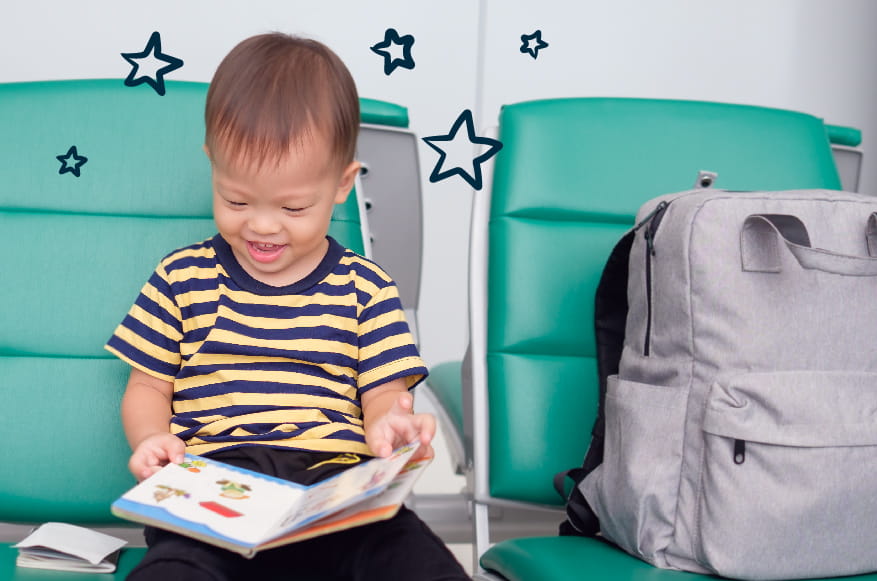 boy reading on airplane