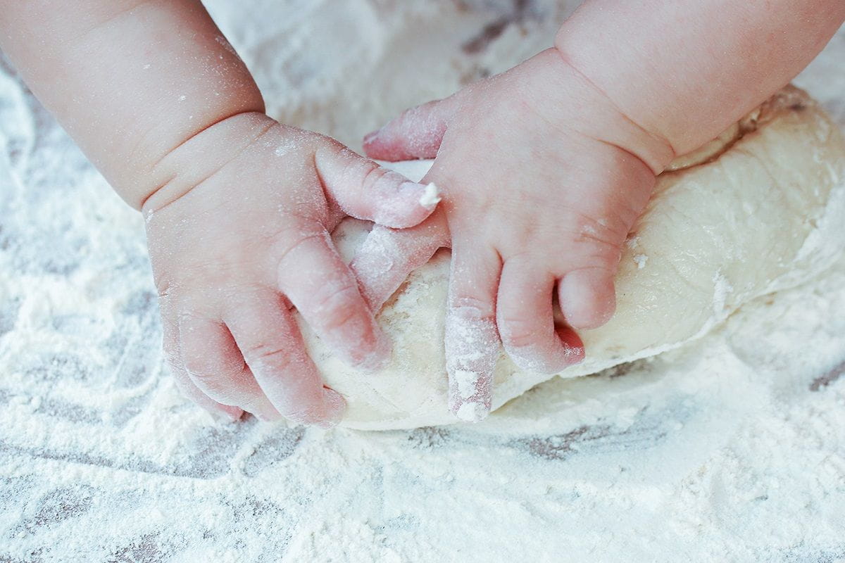 Baby hands in flour