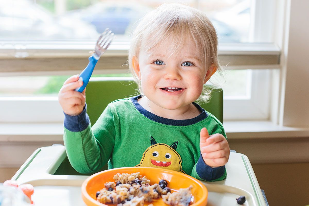baby smiling with oatmeal