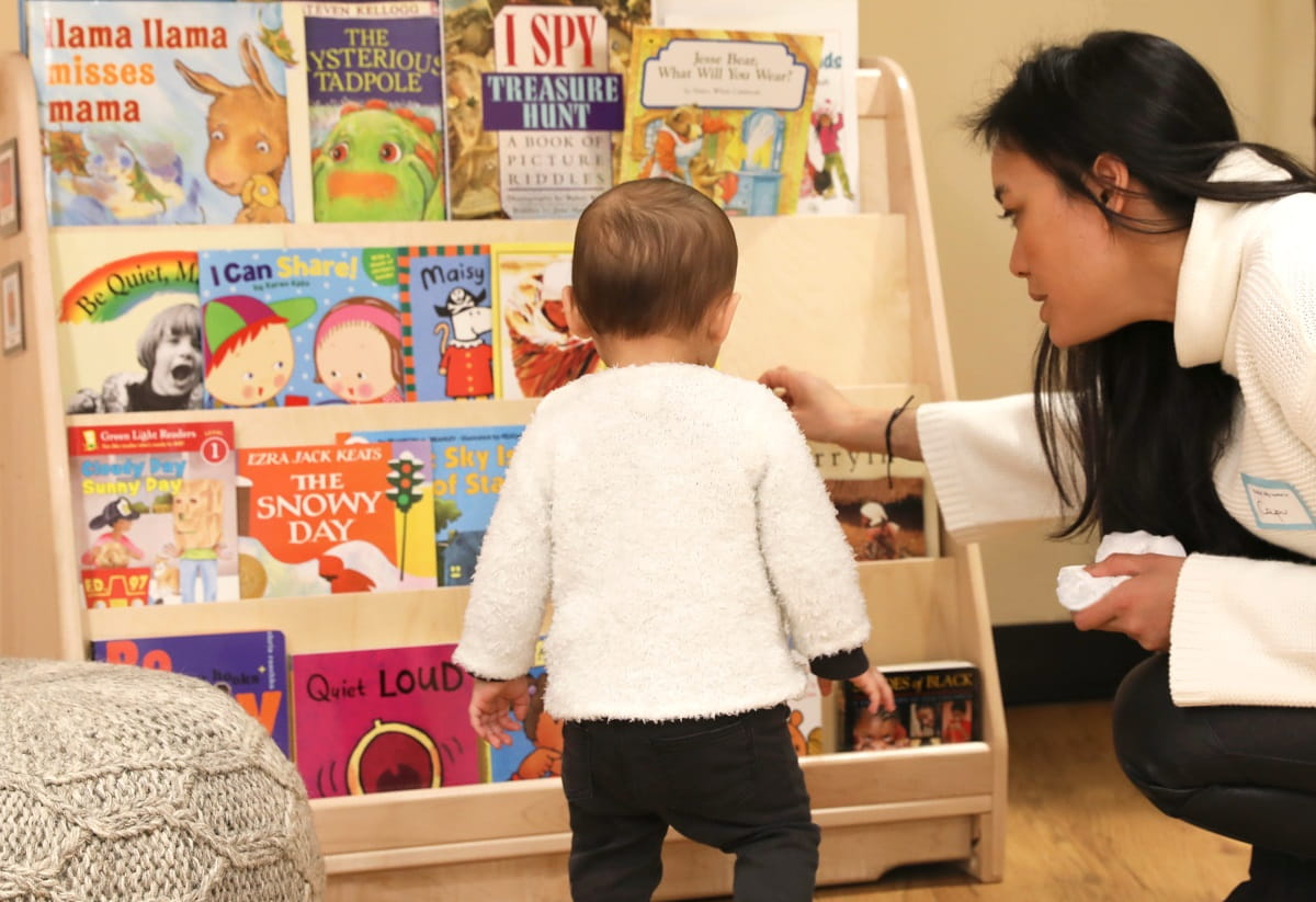 toddler looking at books