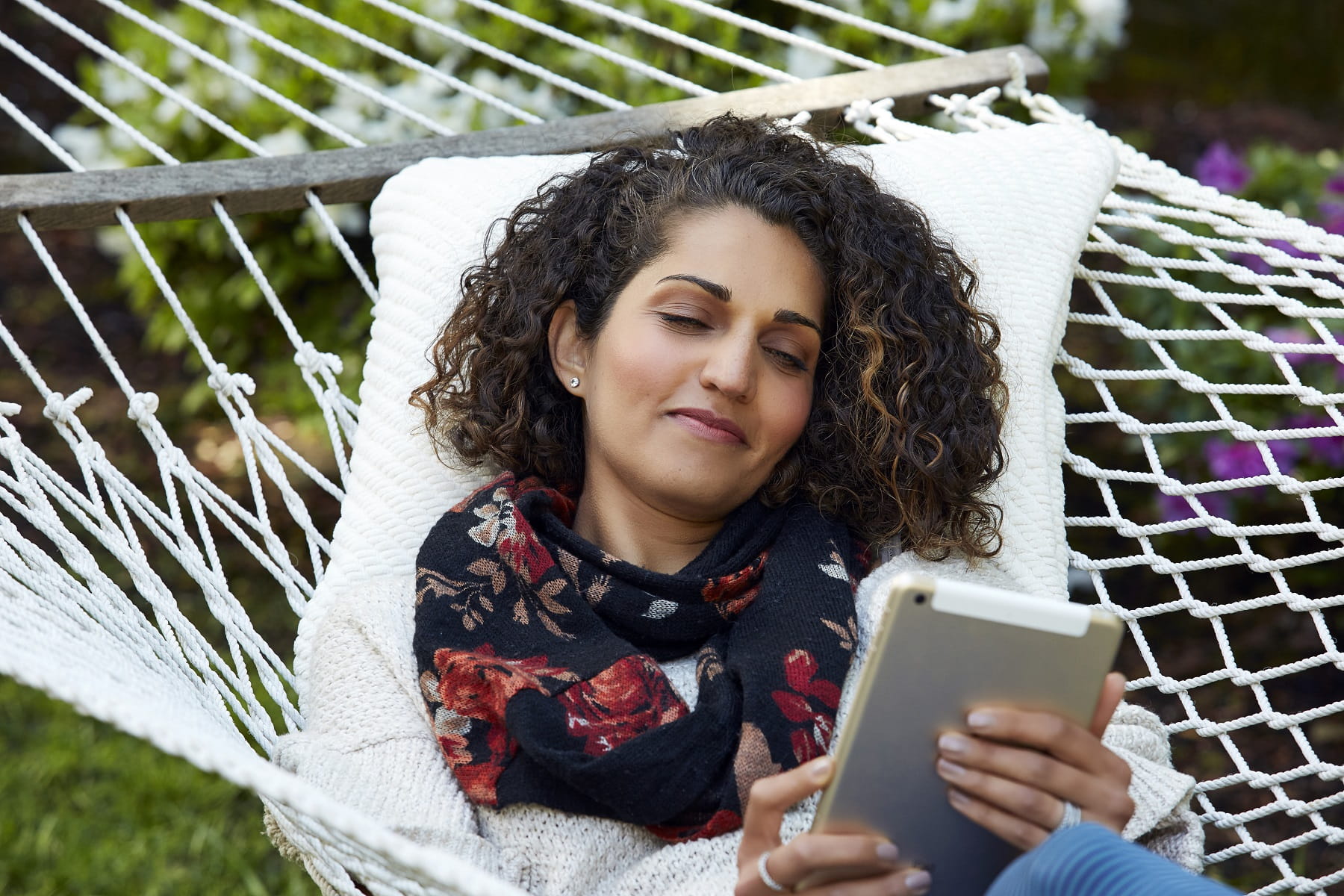 woman in hammock with tablet