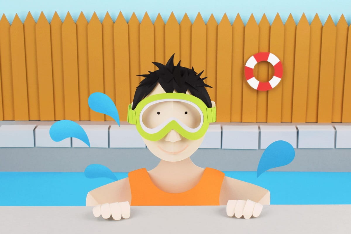 person in goggles swimming