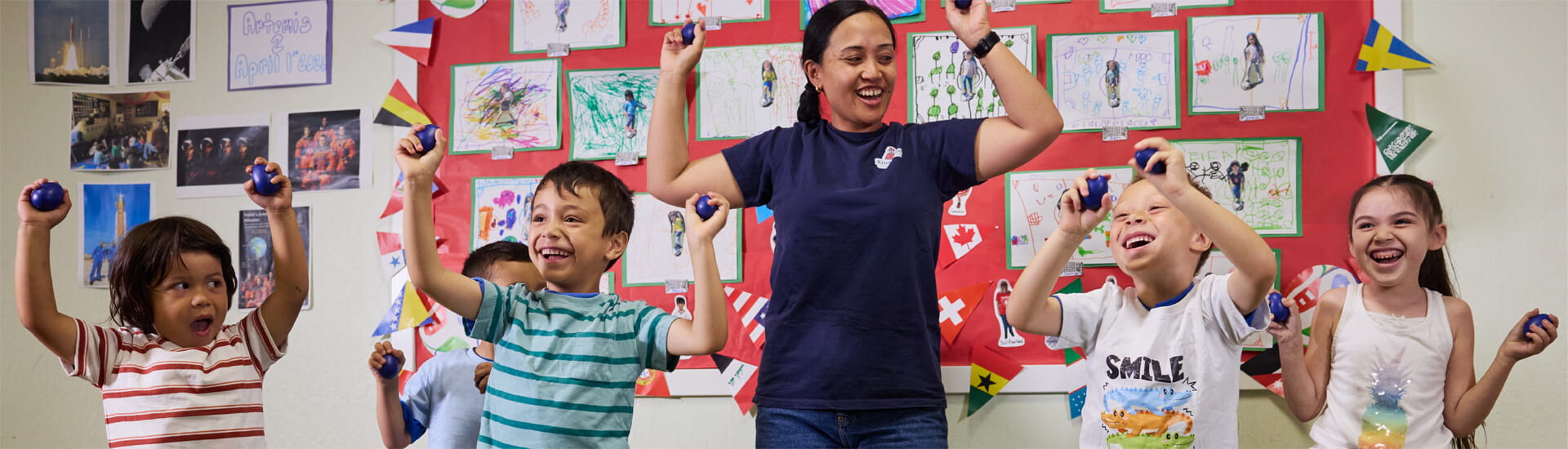 Prekindergarten kids dancing with teacher in the prek classroom