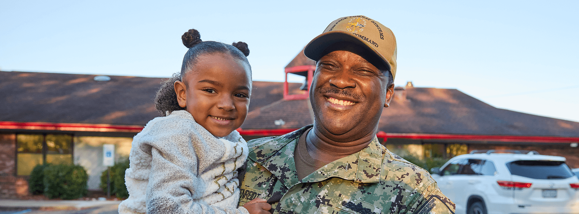 military parent holding child
