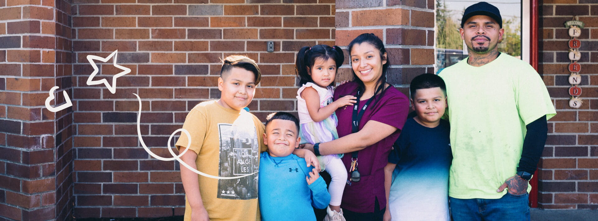 family photo outside of KinderCare center