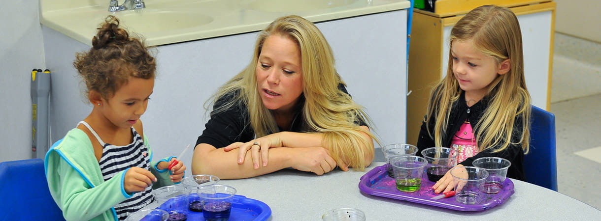 KCE Legacy Award Winning teacher with students