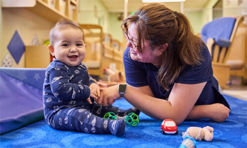 infant with teacher