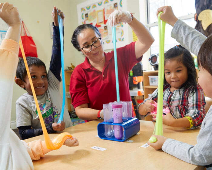 Teacher making slime with preschool kids