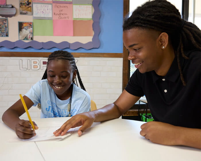 teacher helping student with homework