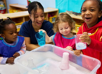 teacher and kids doing an STEM project