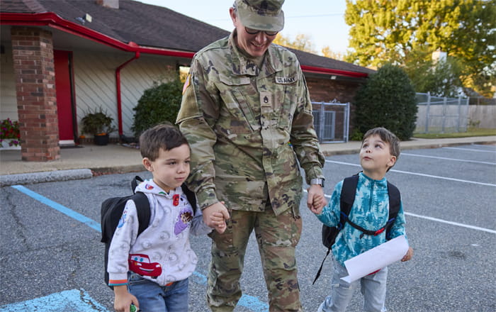 military dad walks with kindergarteners