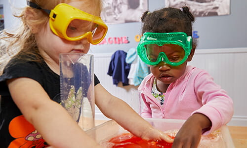 toddlers doing a science experiment