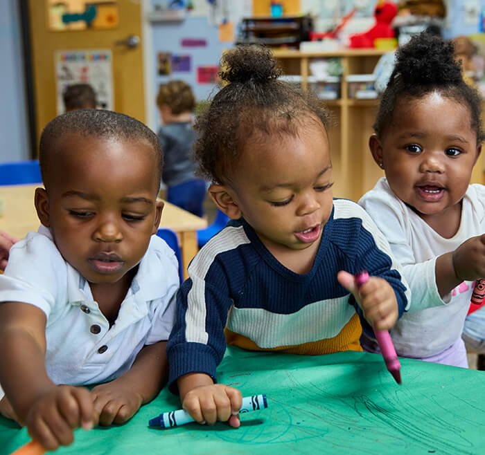toddlers drawing on the table
