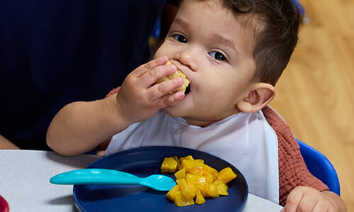 toddler eating at lunch