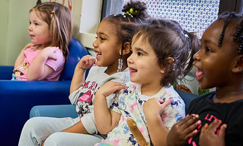 kids smiling in the discovery preschool classroom