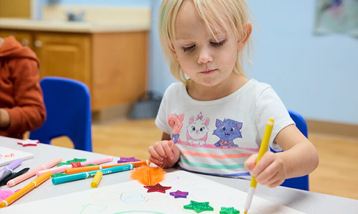 Preschool kid doing art project